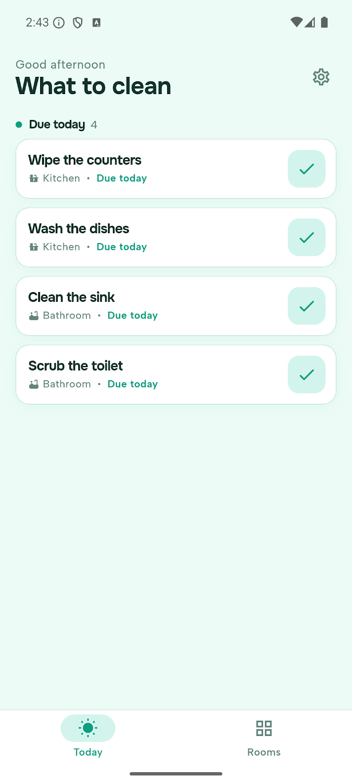 Ecran de planning de menage sur fond vert d'eau, titre What to clean, avec quatre taches listees dont Wipe the counters et Clean the sink, chacune portant une coche verte a droite